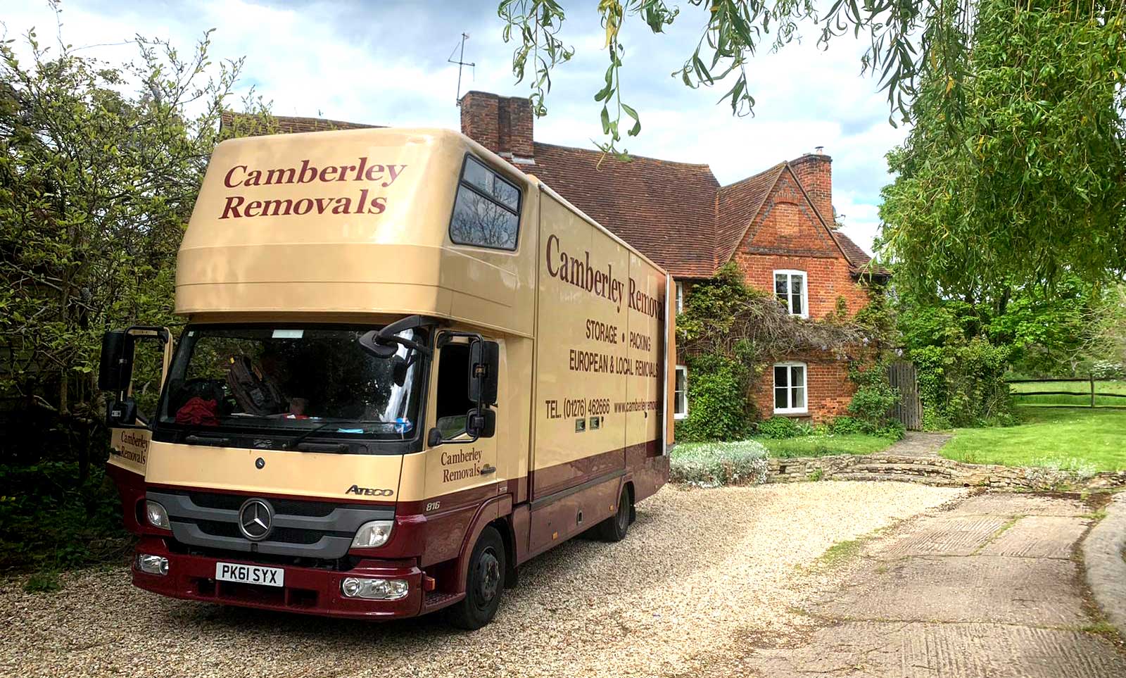 Camberley Removals & Storage lorry at country house