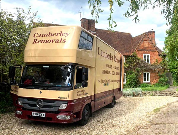 Camberley Removals & Storage lorry at country house