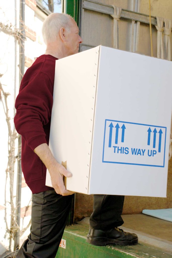 Carrying a box onto Camberley Removals vehicle