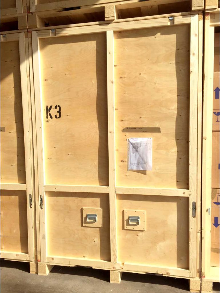 Wooden storage containers in Camberley Removals warehouse