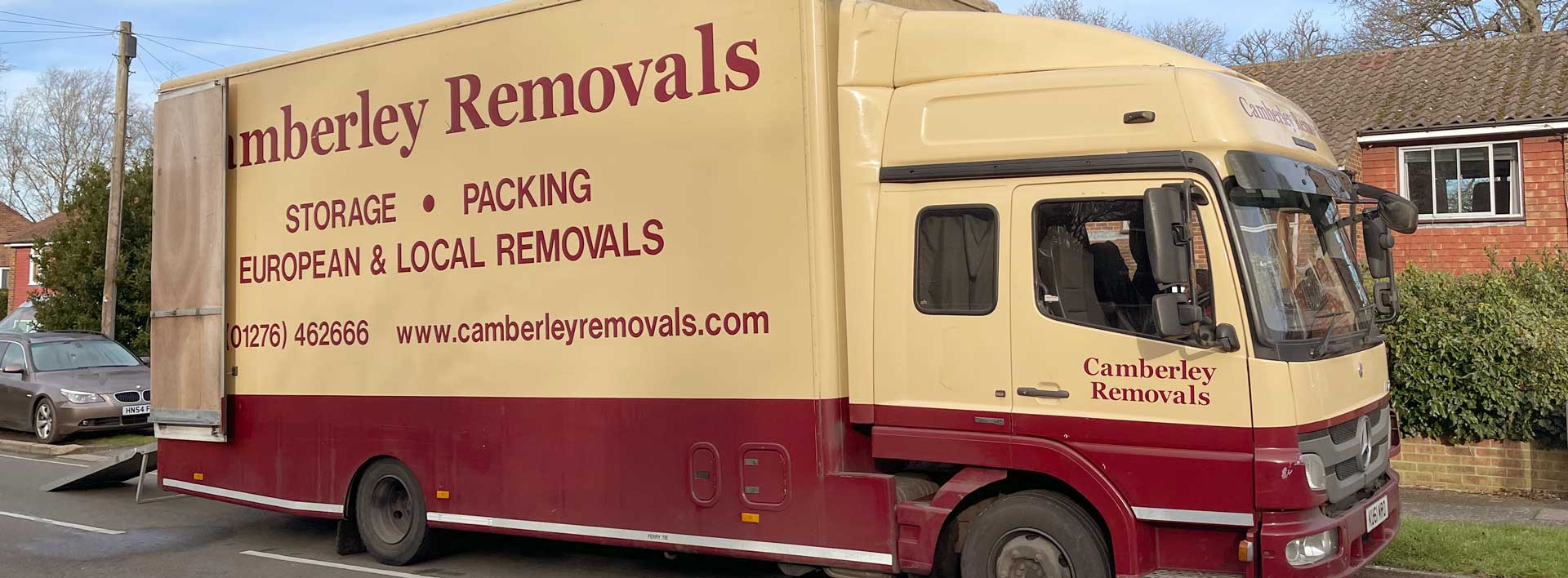 Camberley Removals vehicle being loaded on roadside