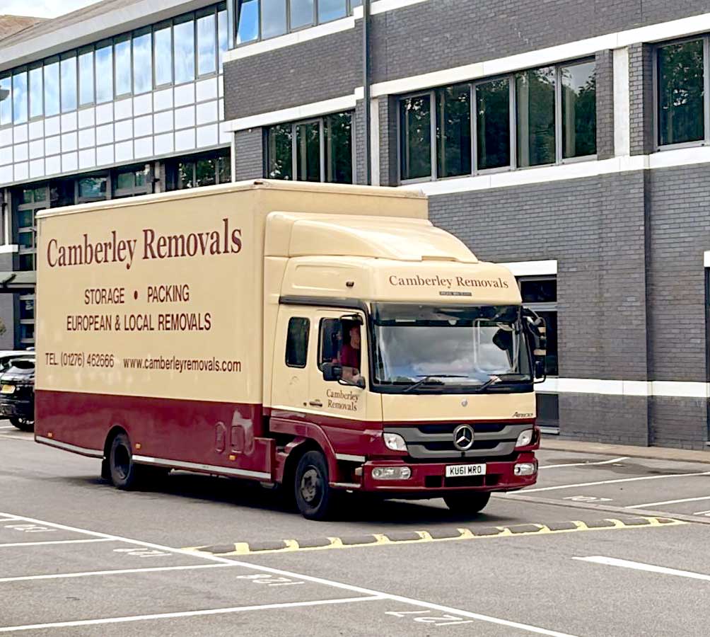 Camberley Removals vehicle outside office building